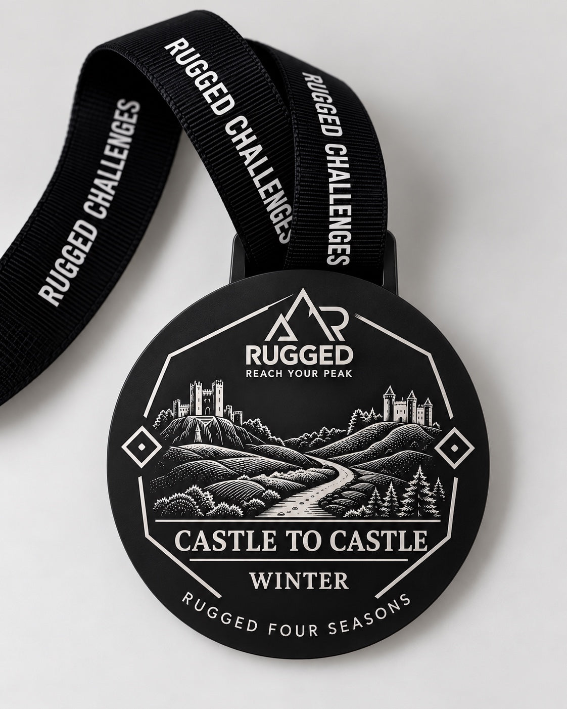 Black Castle to Castle winter finisher medal with RUGGED Challenges ribbon, part of RUGGED Four Seasons.